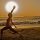 Practising yoga on the beach