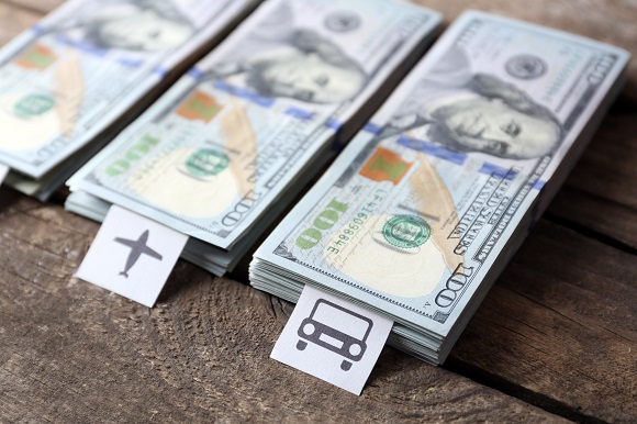 Money with travel icons